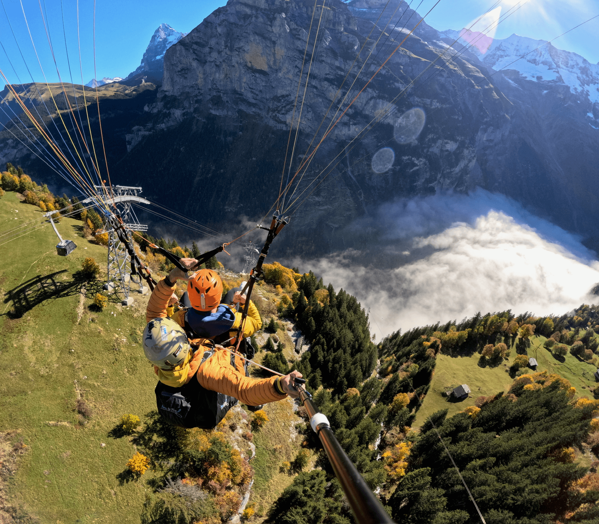 A picture of people (me) paragliding in the Swiss Alps